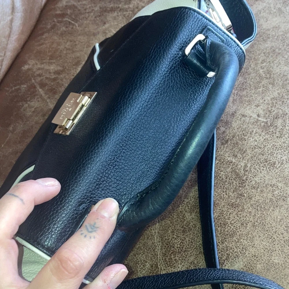 Kate Spade Elegant Black and White pebbled leather Handbag with crossbody strap